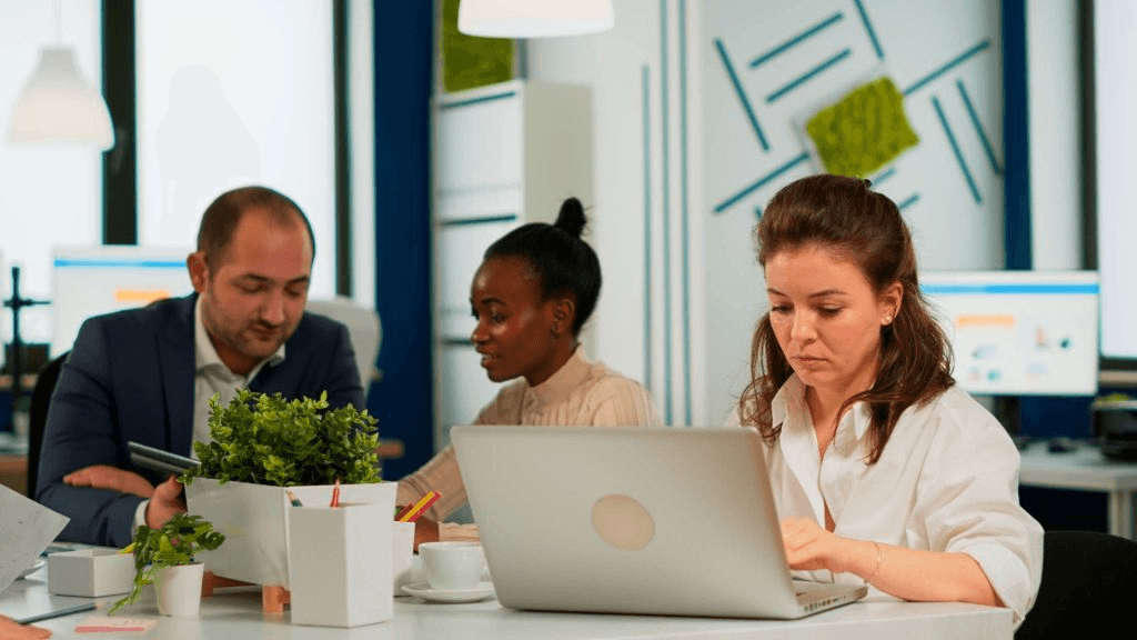 Insurance operations team analyzing case workloads and compliance